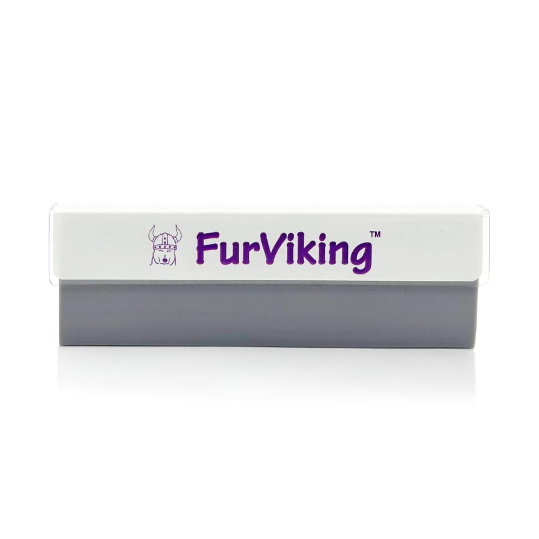 A FurViking pet hair remover tool. It's a small, rectangular device with a white top and a gray bottom. The FurViking logo, featuring a Viking with a dog, is printed on the top in purple.